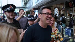 Manchester Mayor Andy Burnham walking along the street