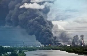 Thick plumes of black smoke and flames rising from an oil refinery in Moscow following a drone attack.